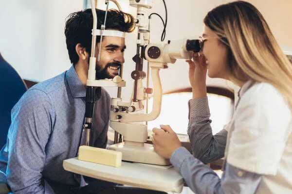 optometrist checking patient eyesight